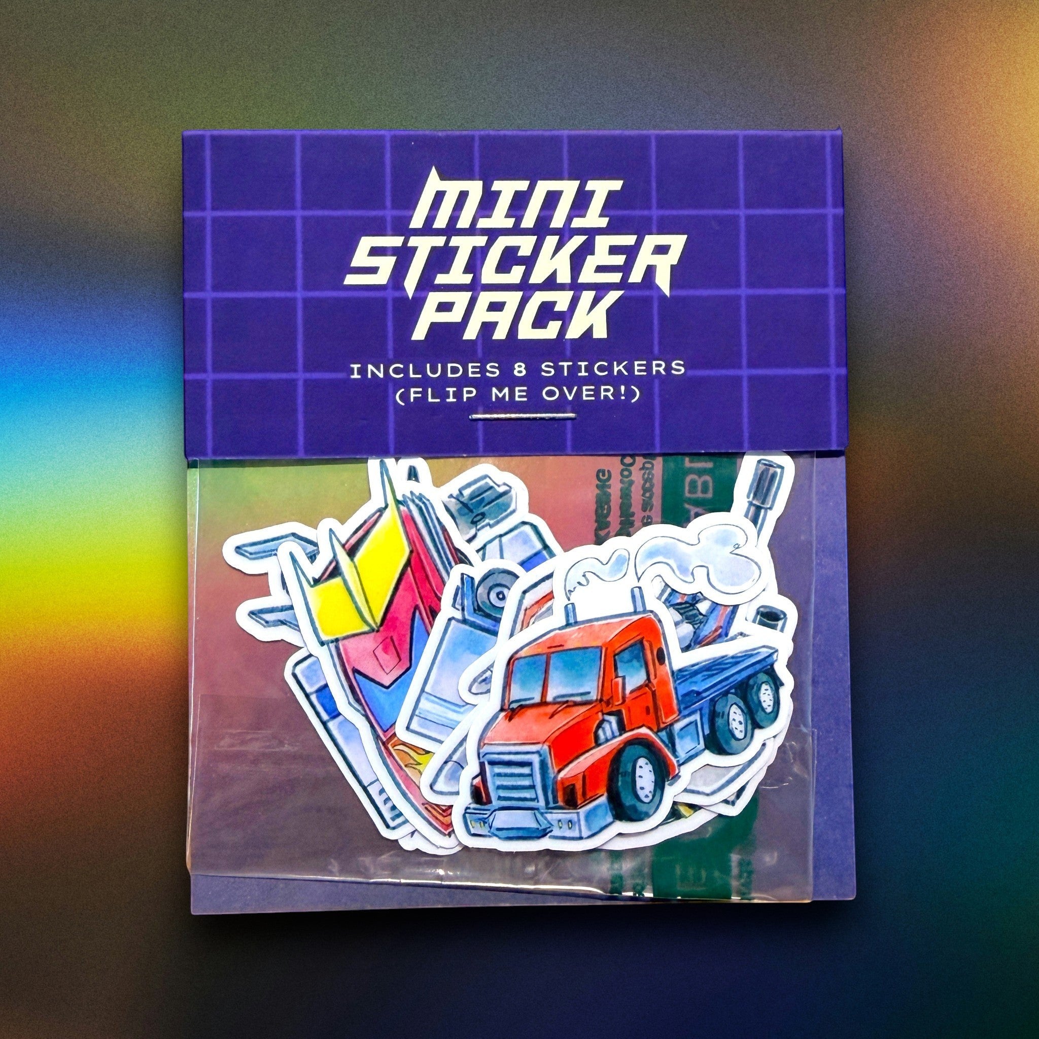 Godliath Alt Mode mini vinyl sticker pack featuring 8 illustrated robot vehicle designs in a compostable bag.