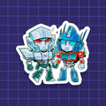 Godliath chibi vinyl sticker featuring Optimus Prime and Megatron holding hands in a cute, colorful illustration.