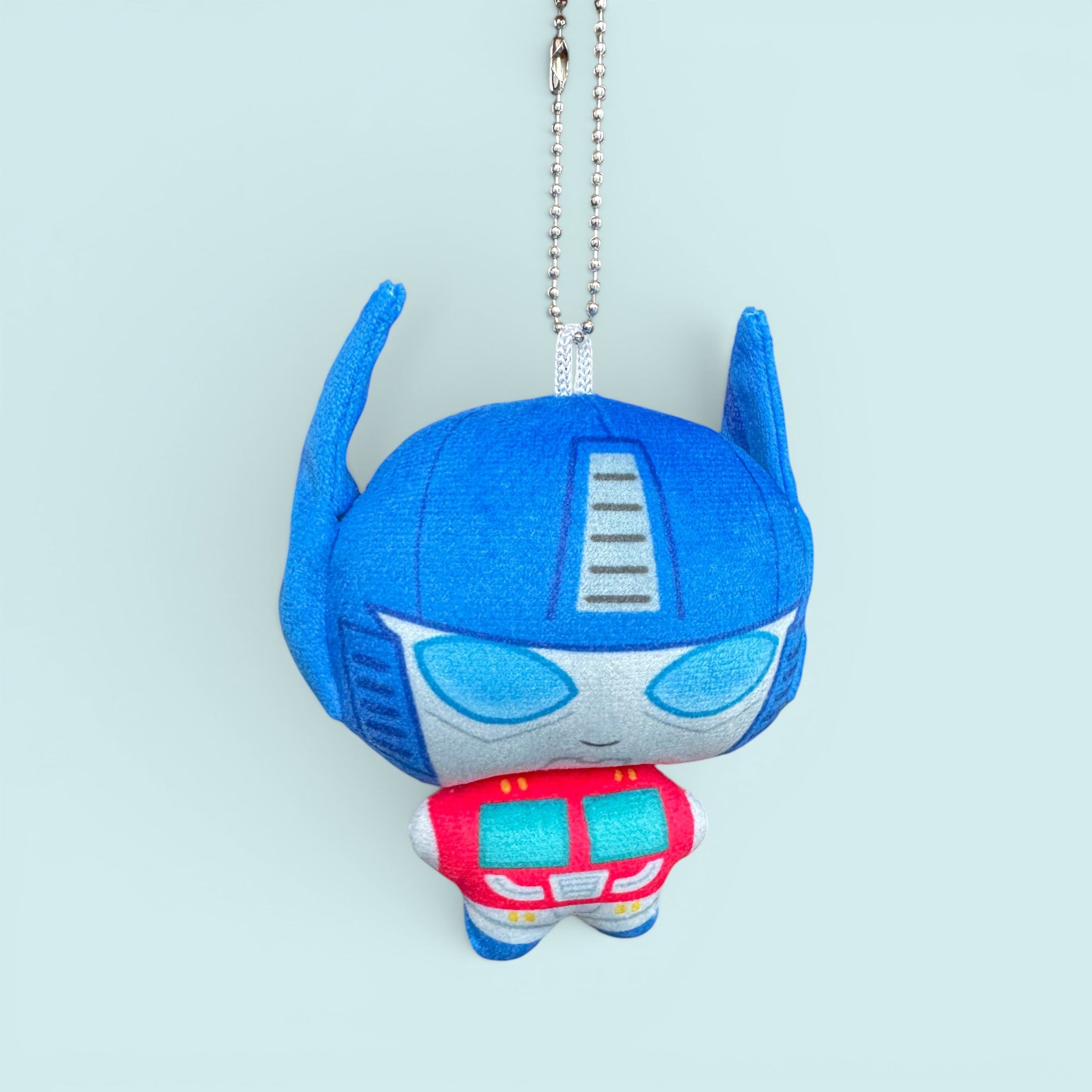 Godliath 4-inch blue and red robot plush charm with a silver ball chain clasp on a light blue background.