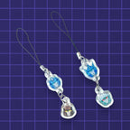Godliath acrylic phone charms featuring illustrated robot character heads on black lanyards against a grid background.