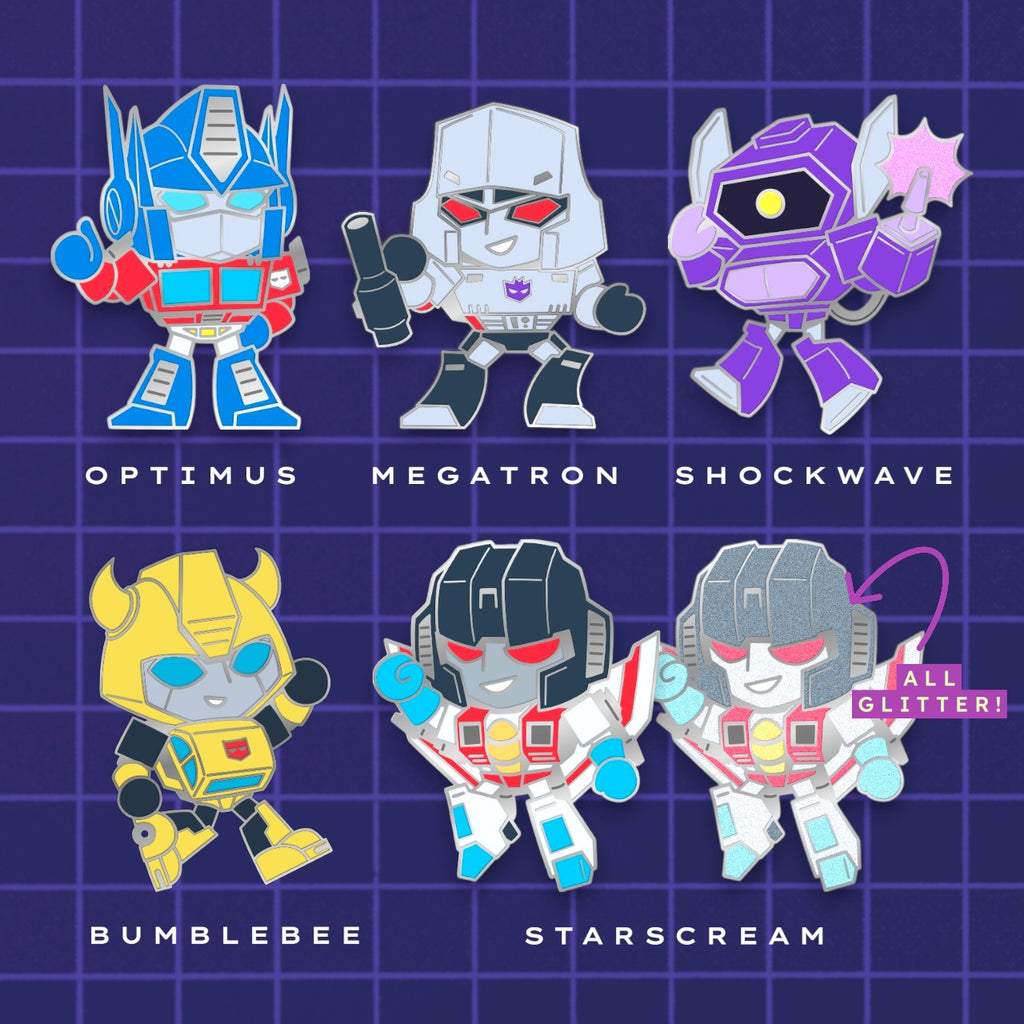 Godliath Tinybots G1 enamel pin set featuring chibi Optimus, Megatron, Shockwave, Bumblebee, and glitter Starscream.