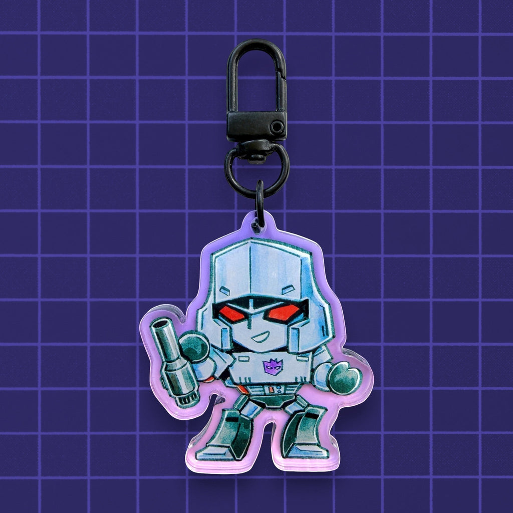 Godliath Tinybots G1 Megatron acrylic keychain with a translucent purple gradient and black lobster clasp.