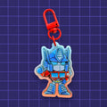Godliath Tinybots G1 Optimus Prime acrylic keychain with a translucent gradient effect and red lobster clasp.