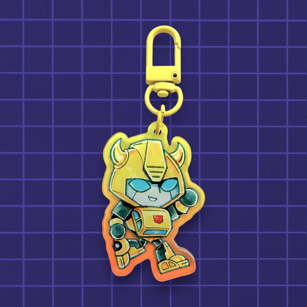 Godliath Tinybots G1 yellow robot acrylic keychain with a translucent gradient effect and a yellow lobster clasp.