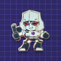 A chibi Transformers Megatron hard enamel pin with translucent enamel eyes