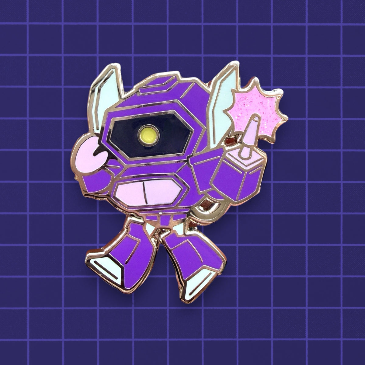 A chibi Transformers Shockwave enamel pin